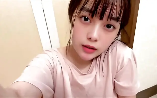 Dim bedroom moment as Japanese student pleasures herself quietly