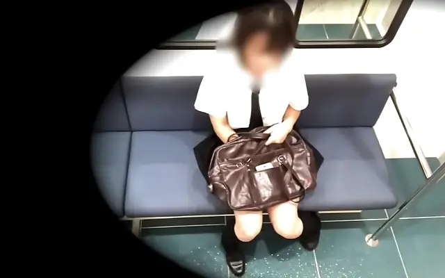 Intense pleasure on the train as she secretly touches herself under her bag