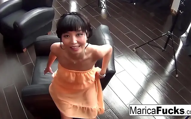 Sunlight streams through sheer curtains as Marica Hase teases her tight pussy solo