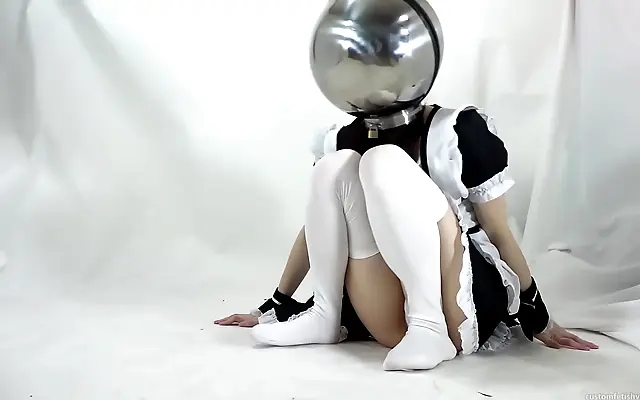 Metal mask muffles her moans as Japanese beauty writhes helplessly