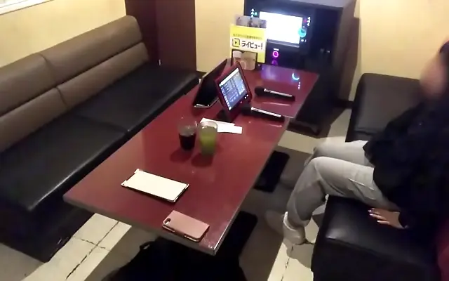 Seated with legs parted, a bubbly Japanese teen sings soft moans between strokes