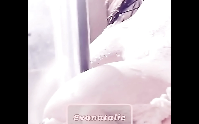 Teasing her big tits in silky lingerie, Evanatalie plays solo